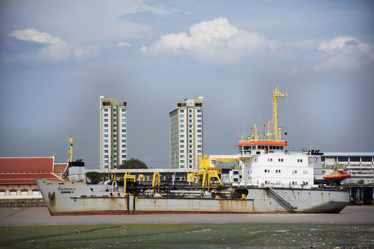 Logistic ship stop wait water level up at estuary of Chao phraya river at Amphoe Phra Samut Chedi