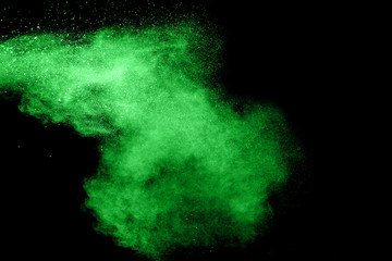 Green Color powder splash cloud isolated on black background