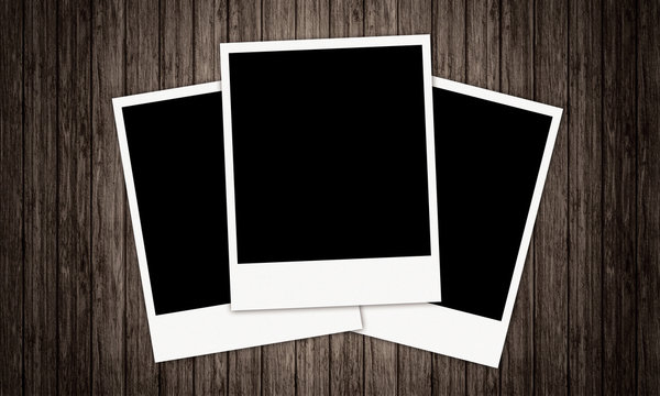 Three Old-fashioned vintage Photo Frames with a wood background 