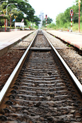 Fototapeta na wymiar Railroad tracks during train station, empty platform wait for train cargo container, tourism journey by rail