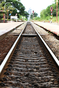 Railroad tracks during train station, empty platform wait for train cargo container, tourism journey by rail