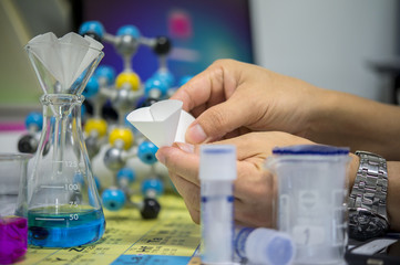 Scientists are folding filter paper for use in chemical filtration, Capillary tubes