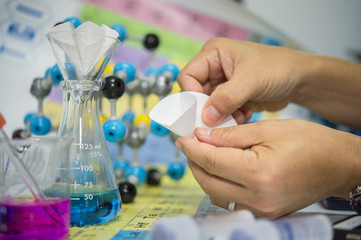 Scientists are folding filter paper for use in chemical filtration, Capillary tubes