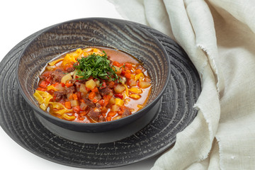 Plate of vegetable soup with meat