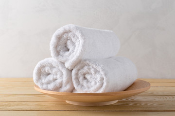 Fototapeta na wymiar spa towels on wooden surface