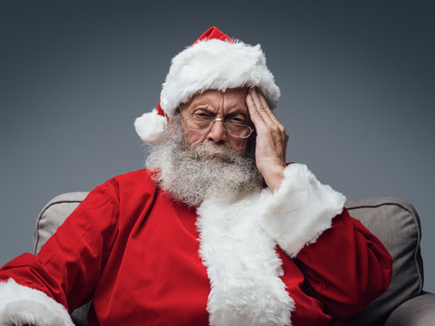 Santa Claus is having an headache