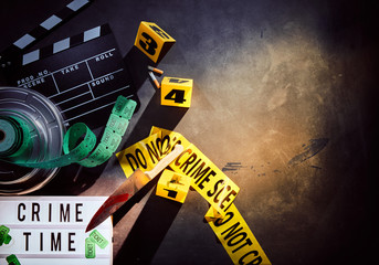 White sign titled crime time next to film reel