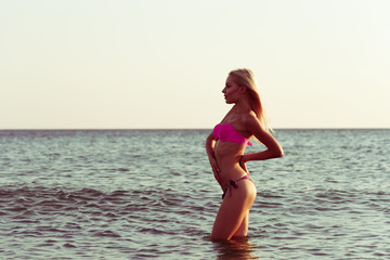 Fototapeta na wymiar Woman in bikini on beach