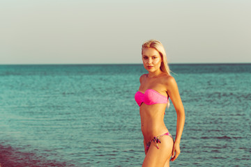 Obraz premium Woman in bikini on beach