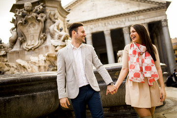 Obraz premium Happy loving couple, man and woman traveling on holidays in Rome, Italy