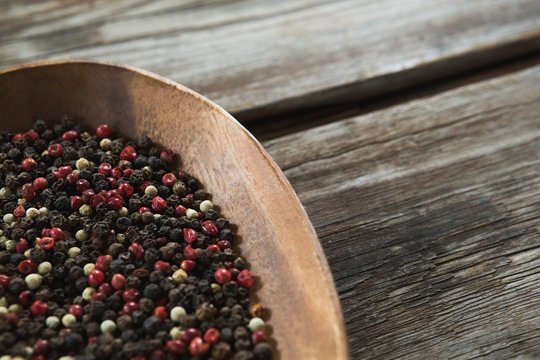 Mix Peppercorns In Wooden Bowl