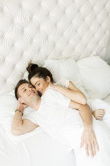Obraz na płótnie Canvas Loving couple in the bed