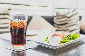 a glass of cola in restaurant