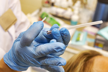 Detail of polylactic acid filament inside the cannula to perform facial lifting procedure named pdo thread	