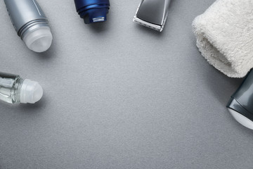 Set for personal care with deodorants on gray table