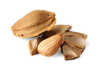 Apricot kernels on white background
