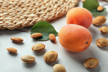 Apricots with kernels on table