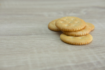 CRACKERS
Pile of crackers on the wood top table. 