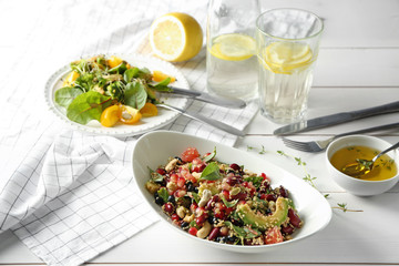 Composition with superfood salads on white wooden table