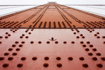 Details of the Golden Gate Bridge, a painted red suspension bridge spanning the Golden Gate strait, the channel between San Francisco Bay and the Pacific Ocean