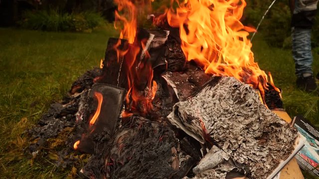 Burning books in a bonfire