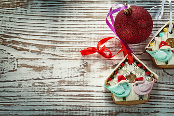 Christmas bauble gingerbread cookies on vintage wooden board