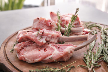 Raw ribs and seasoning on kitchen table
