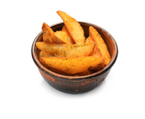 Bowl with delicious baked potato wedges on white background