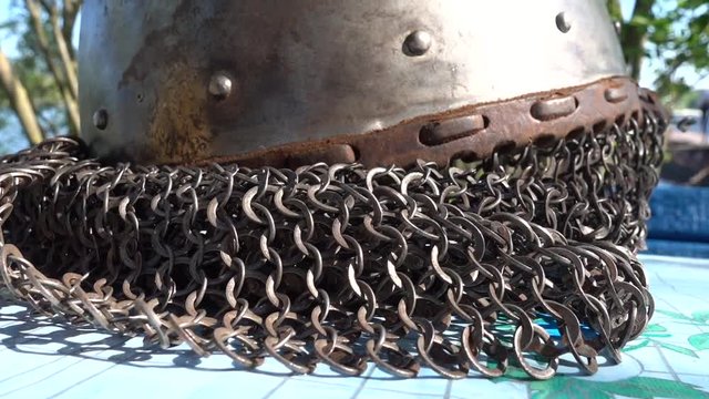 Close up chain armor of medieval helmet, tilt