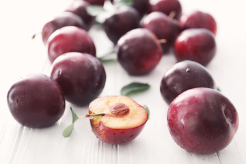 Fresh ripe plums on white background, closeup