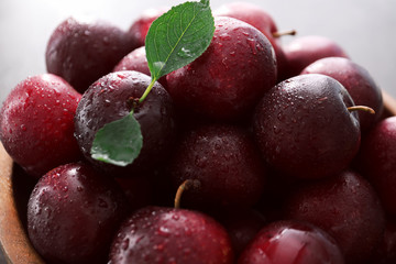 Bowl with fresh ripe plums, closeup