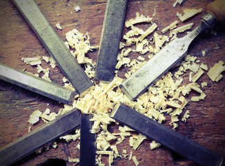 blade of sharp chisels with sawdust and vintage effect