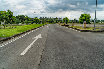 Fototapeta na wymiar Asphalt road with arrow sign