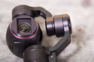 Close up of Osmo Mobile gimbal, new generation of electronic stabilizer over a gray background