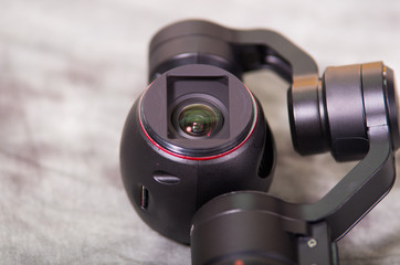 Close up of Osmo Mobile gimbal, new generation of electronic stabilizer over a gray background