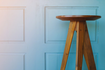 Empty wooden chair on vintage blue wood background