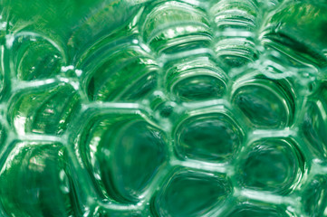 Abstract background of bubbles of green color.