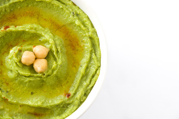 Avocado hummus in bowl isolated
