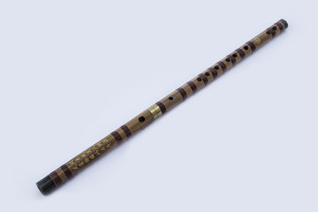 Chinese dizi flute laying diagonally on a white background - 171631032