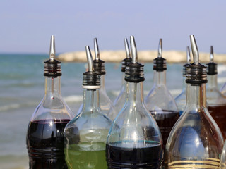 bottles of sugary syrup to prepare drinks and grenades on the be