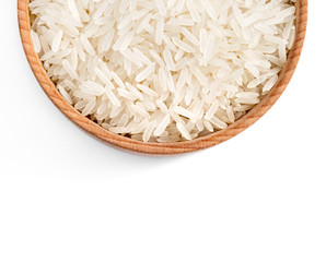 Close up of wooden bowl filled parboiled rice on white background. Healthy food. Top view, high resolution product