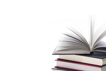 Hardcovered books on white background, close up