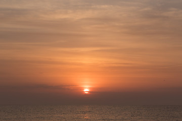 sun rising over the mediterranean sea