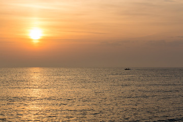 sunrise over the mediterranean sea with patrol boat