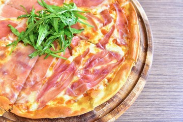 Close-Up View of Prosciutto di Parma Pizza with Organic Wild Rocket