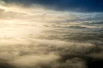 Obraz premium Mist sunrise over mountain and forest