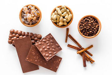Ingredients for chocolates on white background top view