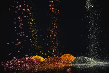 Fototapeten Powdered spices against black background © WavebreakMediaMicro