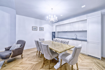 Modern design white kitchen in a spacious apartment.