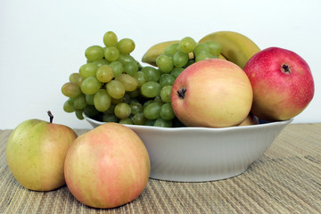 Naklejka na ściany i meble the bowl of fruit on a white background